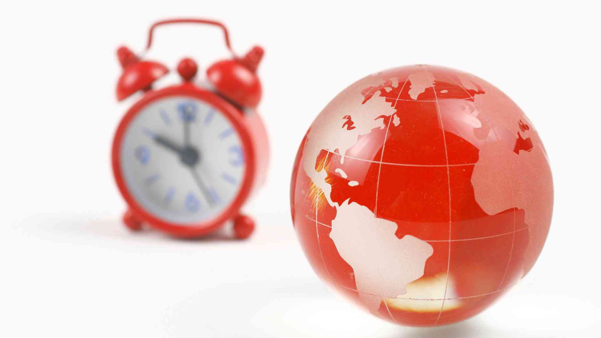A clock and globe symbolizing the time zone and availability